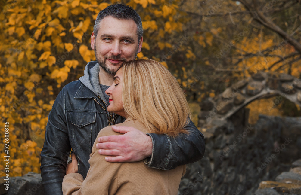 Fototapeta premium Romantic European couple in the park love, warmth and emotional connection
