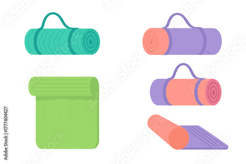 Colorful collection of rolled and unrolled yoga mats for fitness and meditation