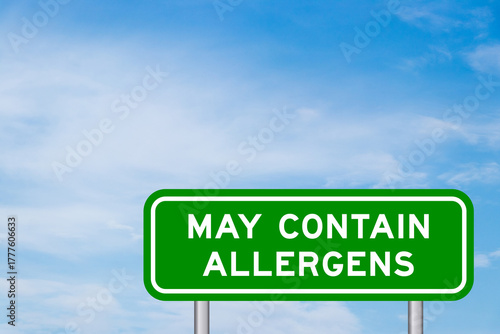 Vászonkép Green color transportation sign with word may contain allergen on blue sky with