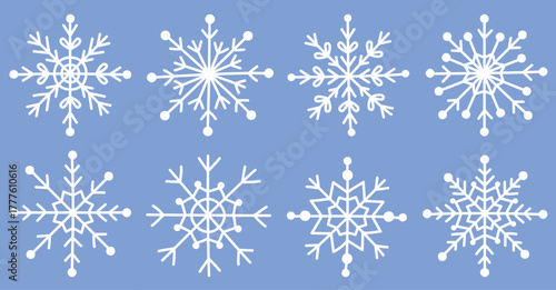 Set of cute white snowflakes isolated on blue background.