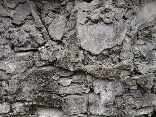 Background of very old stone wall texture photo