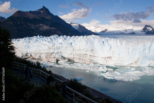 Panoramic view of Perito Moreno massive glacier in Calafate town, Argentinean Patagonia, with tourists in the foreground