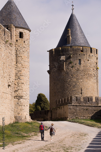 Couple walking in Carcassone Castle in France