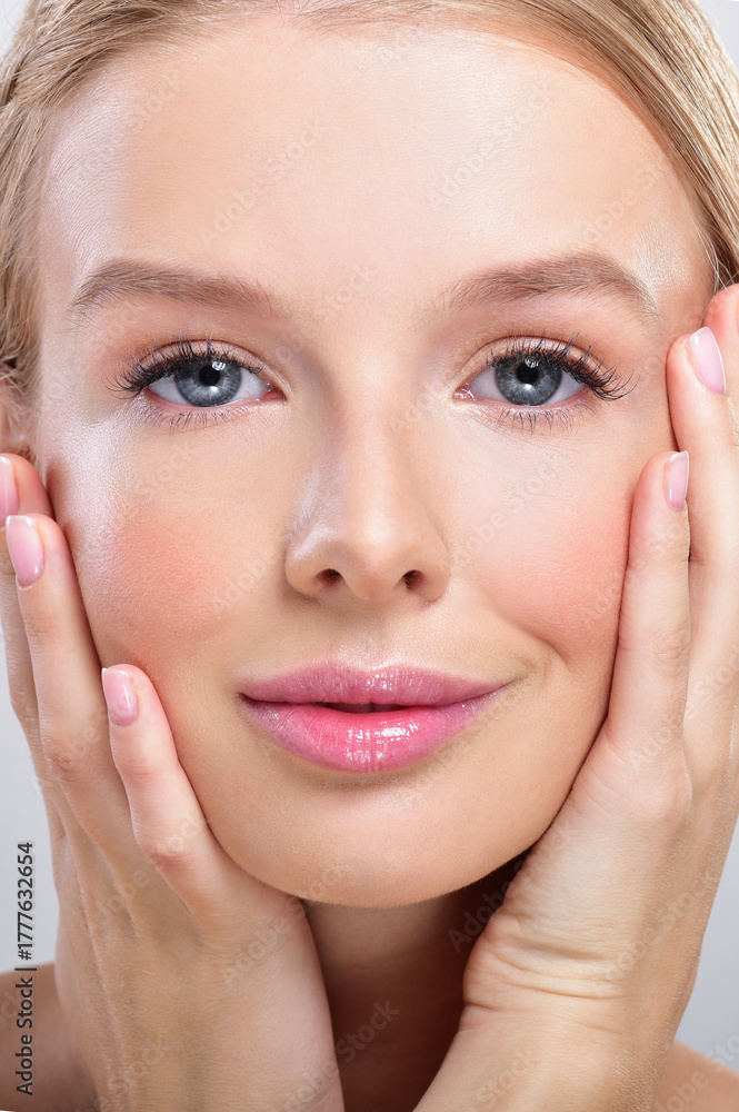Fototapeta premium Beautiful face of young adult woman with clean fresh skin.