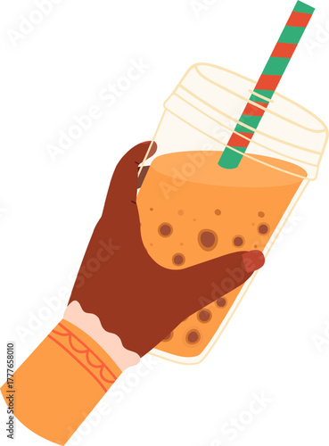 Hand holding bubble tea drink with straw