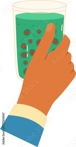 Hand holding green smoothie with berries beverage