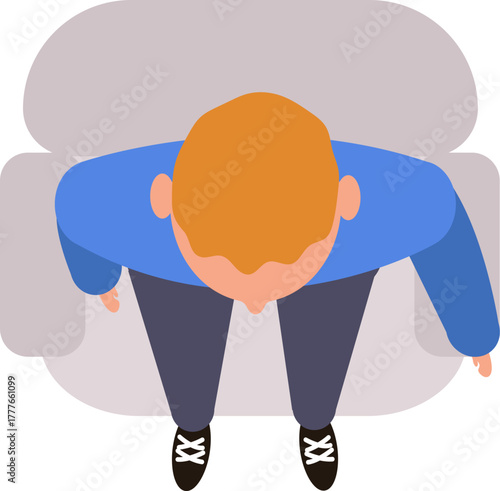 Man with red hair sitting on sofa top view