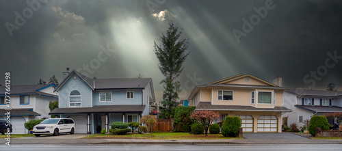 Row of residential houses on stormy sky background