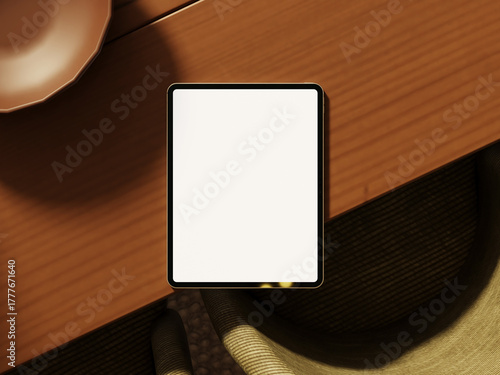 Modern tablet mockup on wooden table with ambient lighting.