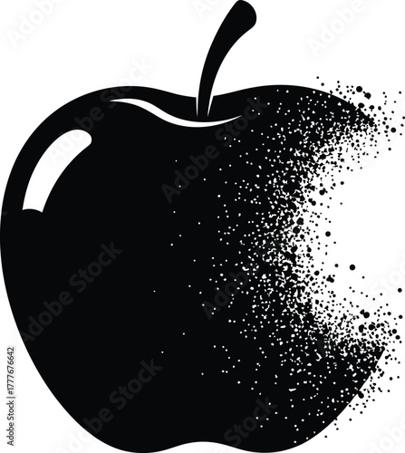 A black apple is dissolving into tiny particles from right side