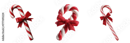 Three candy canes with red bows isolated on a transparent background 1