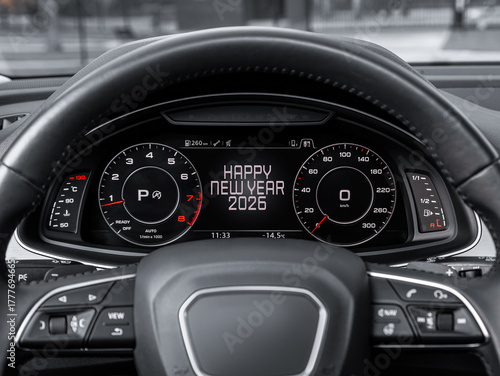 Close-up of an automobile instrument panel displaying odometer, speedometer, tachometer, and fuel level, with a message saying 