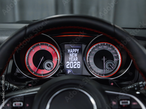 Close-up of a black speedometer with the message 