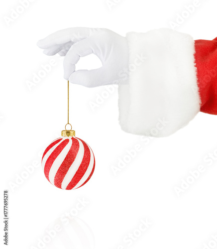 Christmas Santa Claus hand holding Christmas ornament red and white for Christmas tree isolated on white background with clipping path. Design element.