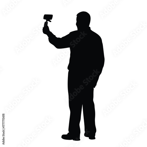 Standing Man Silhouette Taking Selfie or Vlogging with Phone on Stick