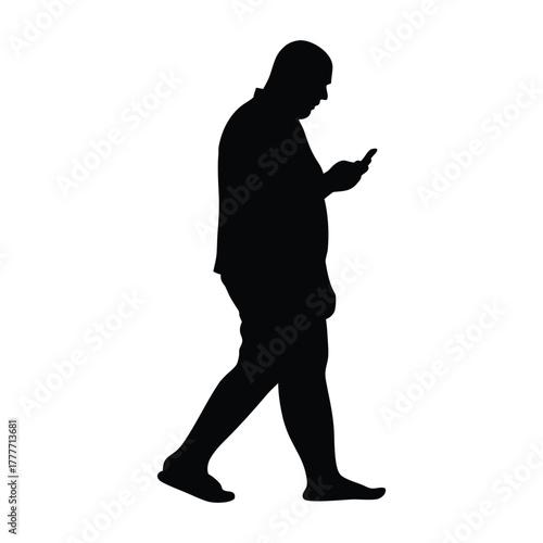 Side View Silhouette of Man Walking and Texting on Mobile Phone