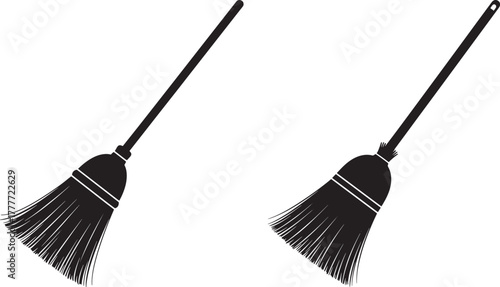 Two black broom cleaning tools silhouette