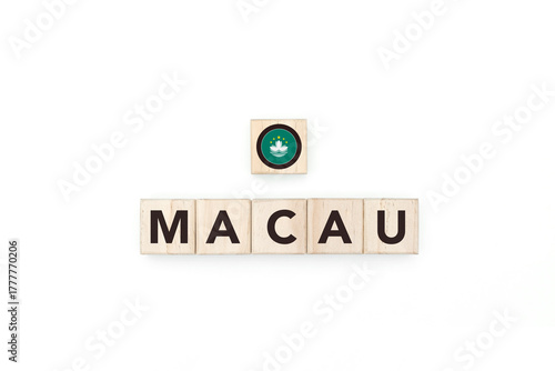 Wooden blocks bearing the name and flag of Macau. Macanese and Asian Culture, national identity, travel, and geography in an advertising space design.