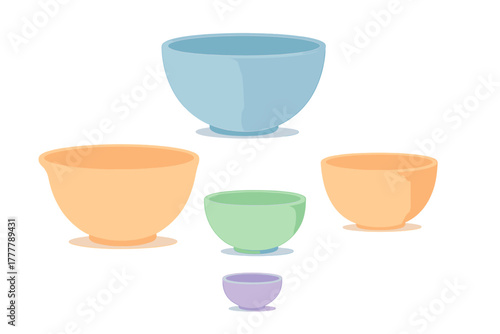 Assortment of pastel colored kitchen mixing bowls in various sizes for cooking and baking