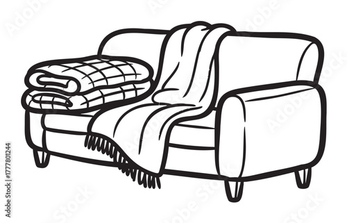 Black outline icon of a cozy sofa with two folded blankets and a draped throw blanket over the backrest.