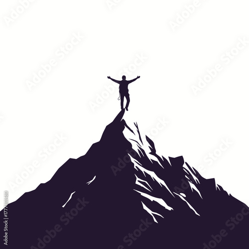 Man standing on mountain peak with arms outstretched in victory silhouette