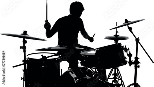 Silhouette of a drummer playing a drum kit with drumsticks.
