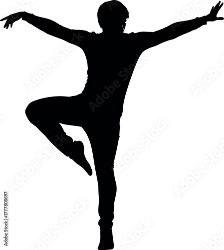 Silhouette of a dancer performing a graceful ballet pose.