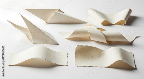 Vector illustration of six abstract sculptures made from folded textured paper arranged on a white background