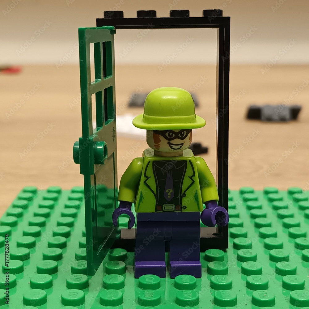 Naklejka premium LEGO DC Comics Super Heroes The Riddler minifigure stands in an open green doorway on a green baseplate