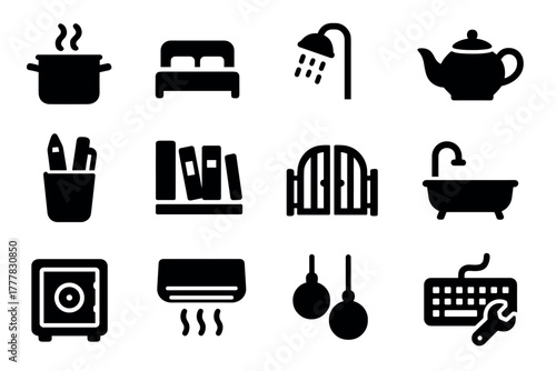 Essential household icon set featuring kitchen, bedroom, and office items in bold silhouette style