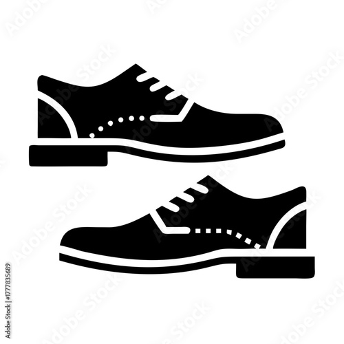Black icon of two mens dress shoes icon