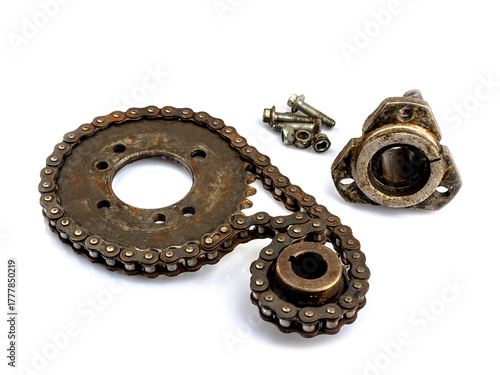 Close up of dirty, oily and greasy old motorcycle chain and sprocket set on white background. The image reflects the essence of repair, maintenance