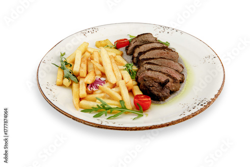 Mouth-watering beef steak with a golden crust of French fries, garnished with fresh herbs and cherry tomatoes, is an appetizing rustic-style dish on an isolated white background