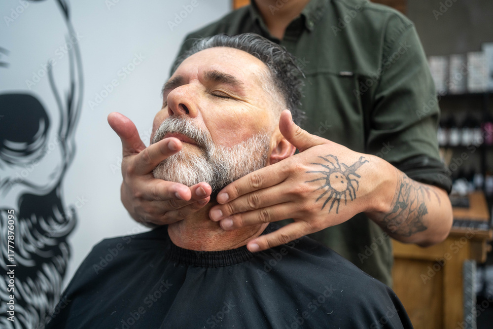 Fototapeta premium Finishing touch. Professional barber styling hair of senior man. 