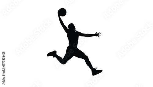 Silhouette of a basketball player jumping and dunking a ball