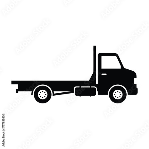 Silhouette of a black flatbed tow truck vehicle isolated on
