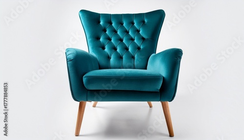 plush teal velvet armchair featuring tufted backrest elegant wooden legs positioned against white background for design inspiration