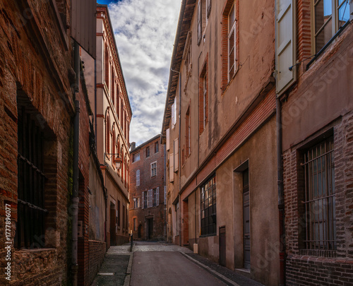 A typical old street in the city of Albi, in the Tarn department, in Occitanie, France.