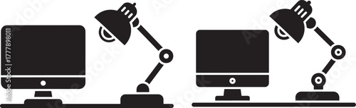 Computer monitors and desk lamps silhouette