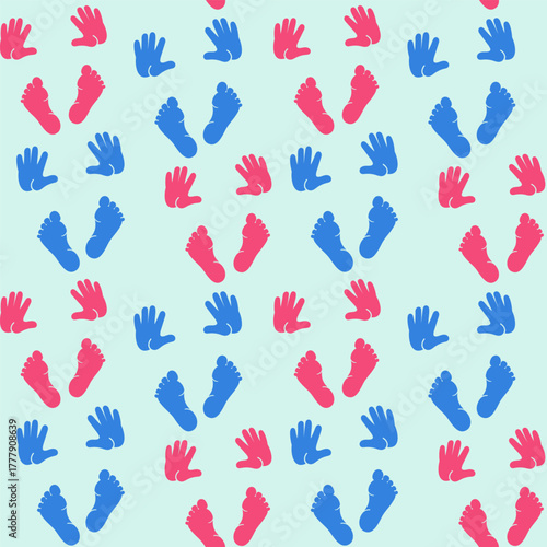 The little hands and feet of a little girl and a little boy. Newborn babies. Pink and blue.