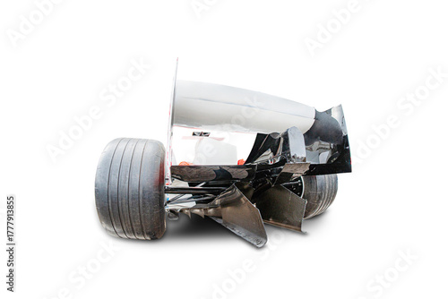 Photos Damaged Formula 1 car, crumpled front, exposed metal, dislodged wheels, white ba
