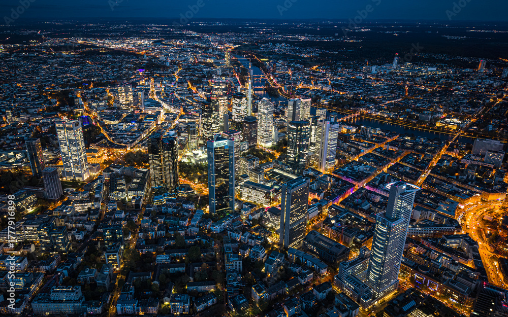 Fototapeta premium High angle view of the illuminated cityscape of Frankfurt am Main during the night