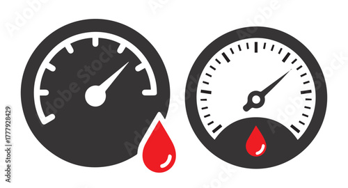Two circular gauges with red drops below indicating measurement or warning meter dial