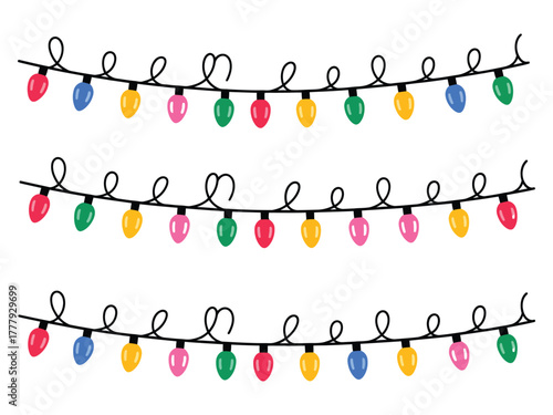 Rows of colorful, festive Christmas lights strung on black cords against a white background.