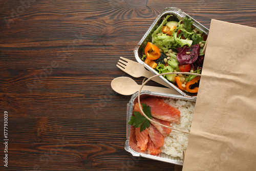 Healthy meal slimming diet plan daily ready menu background, organic fresh dishes and smoothie, fork knife on paper eco bag as food delivery courier service at home in office concept, close up view.