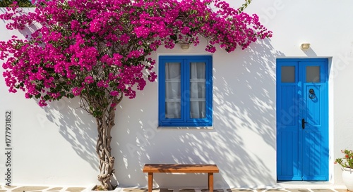 Greek Island Architecture with Bougainvillea building door window flowers pink white blue mediterranean bench exterior wall