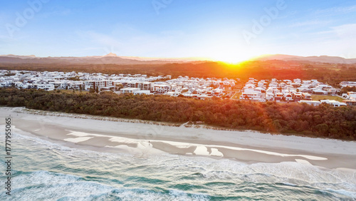 Sunset drone aerial view of beachfront properties at Salt Kingscliff overlooking coastline and ocean