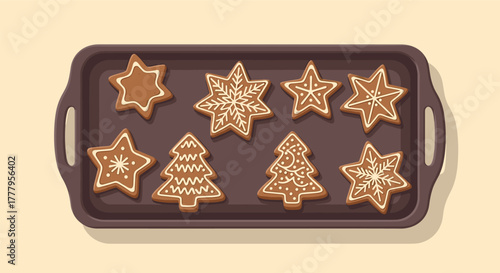 Festive gingerbread cookies on tray with star and tree shapes