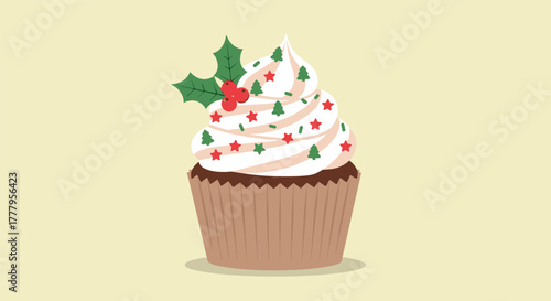 Festive cupcake with holly and christmas decorations on creamy frosting