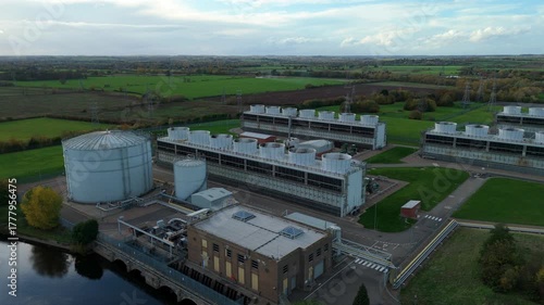 Wallpaper Mural Sweeping aerial drone shot of power plant cooling turbines and fans, powerhouses generating electrical energy from gas and coal, cooling water intakes River Trent near Newark-on-Trent, United Kingdom  Torontodigital.ca